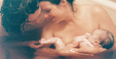 Pregnant Women Giving Birth To A Baby In Water