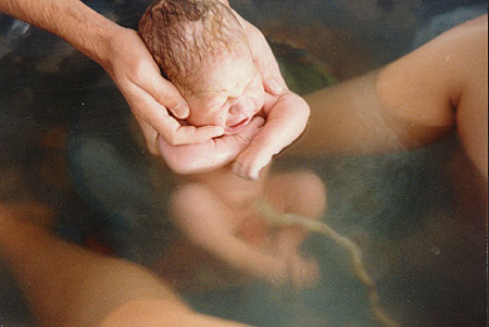 Woman Giving Birth In Water