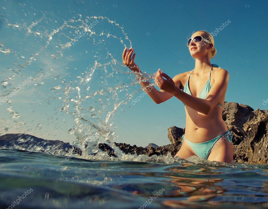 Woman Standing In Water