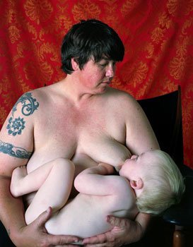 Women Breast Feeding To Her Husband