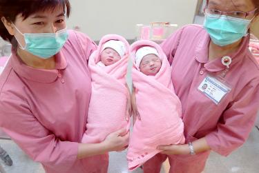 Women Giving Birth To A Baby Naturally In Hospital